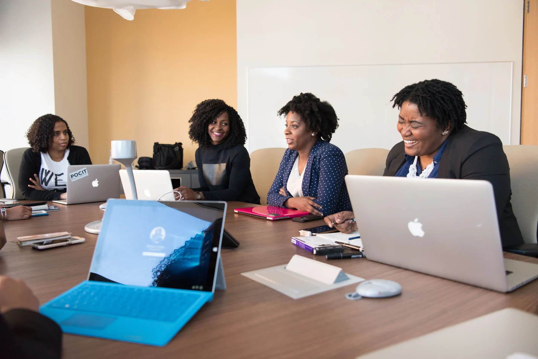 Editorial photograph of a team exchanging ideas at a meeting