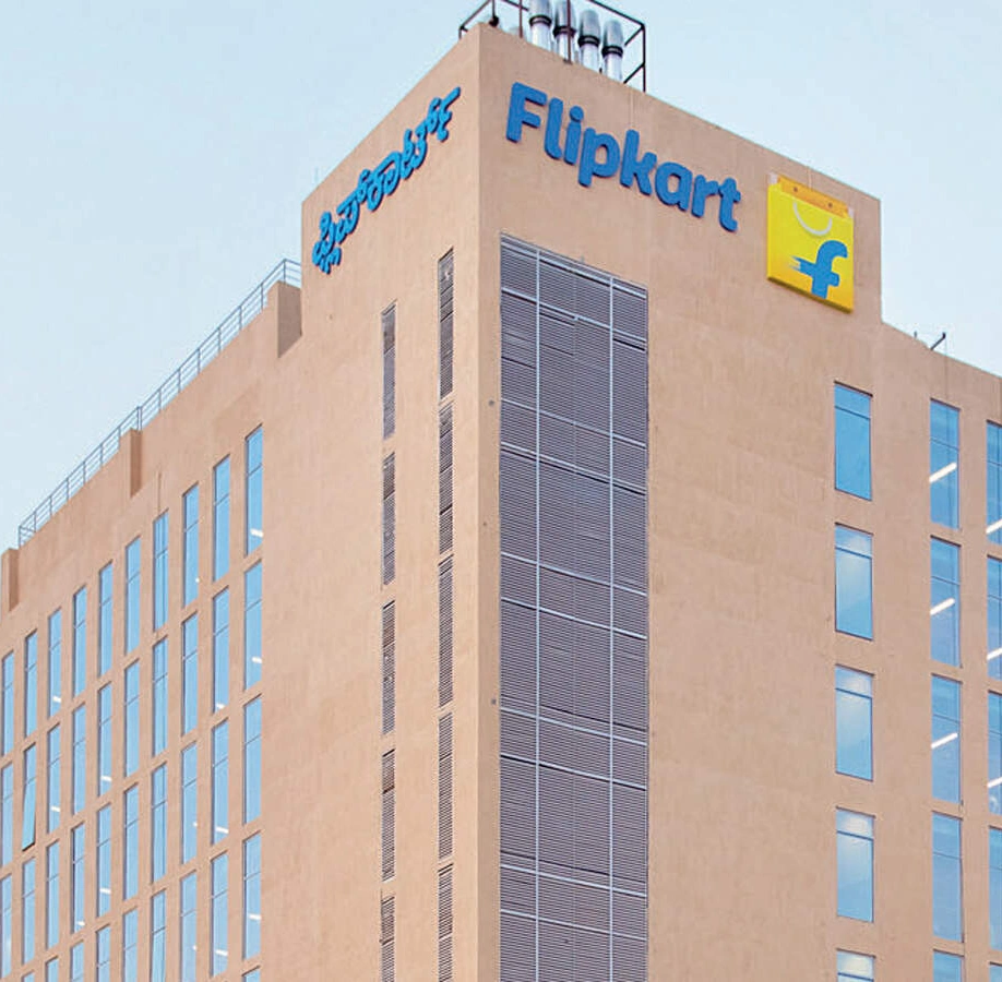 Flipkart wordmark and shopping-bag emblem on its Bengaluru office facade