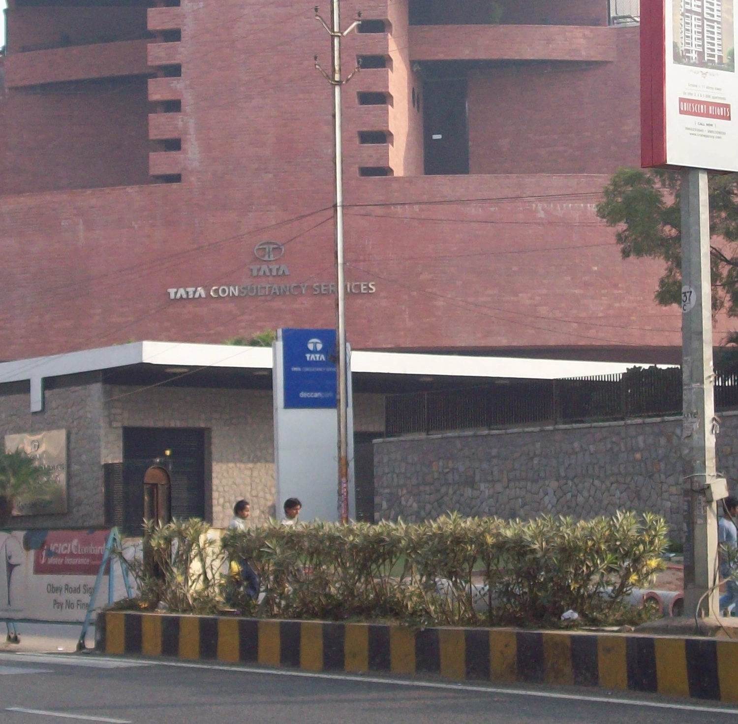 Tata Consultancy Services emblem and lettering on the brick facade of its Madhapur office