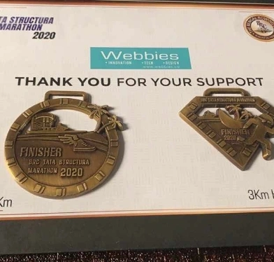 Marathon 2020 medals and a certificate thanking Webbies for its support