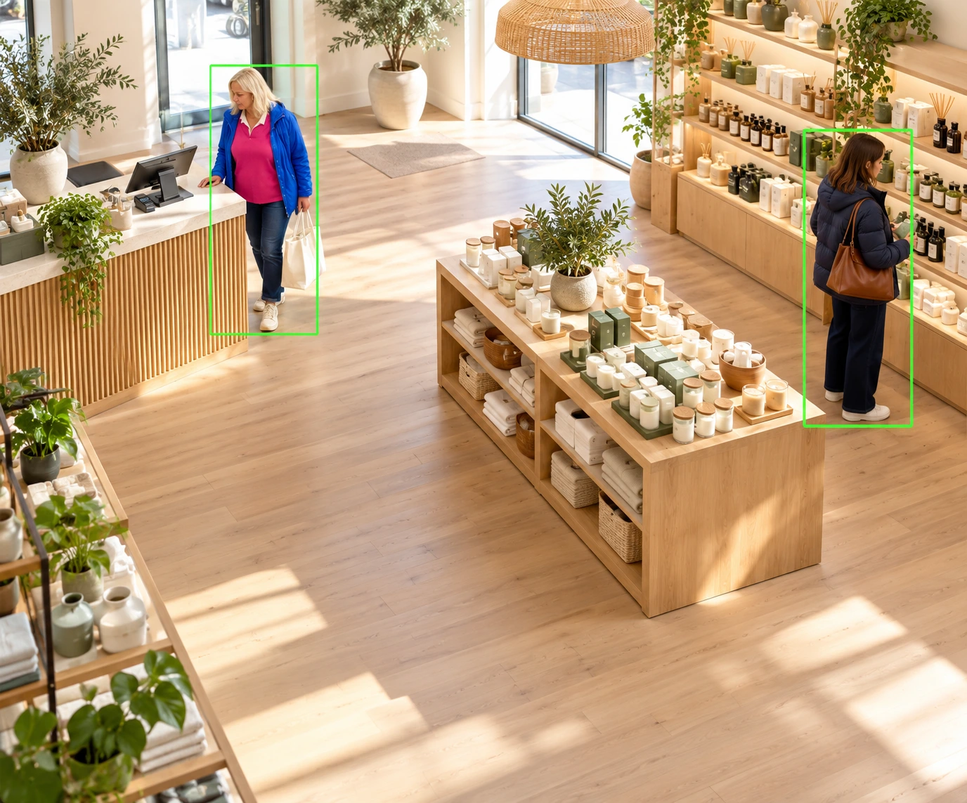 Two shoppers in a spacious retail store with subtle green person-tracking outlines